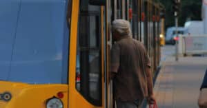 Man Boarding Streetcar