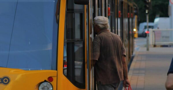 Man Boarding Streetcar