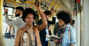 Women Standing On Bus