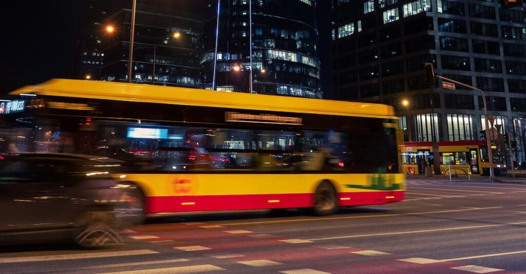 Yellow Bus Busy City Street Nighttime